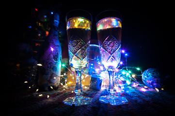 Traditional winter holiday alcohol drink in snow with creative New Year artwork. Copy space. Selective focus