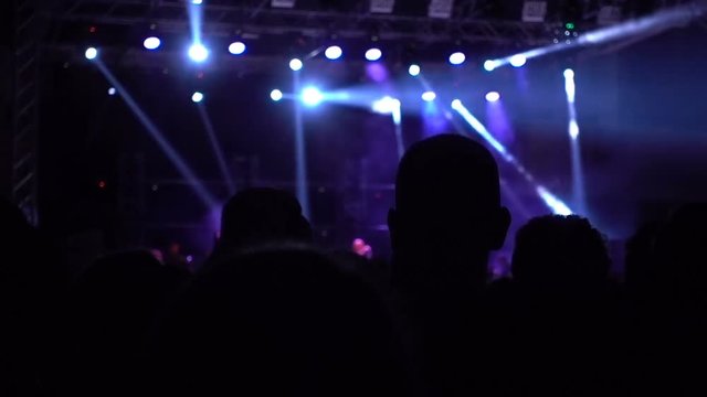 A group of people in a dark room