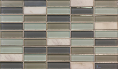 background mosaic tile of green and gray squares of different tones and transparency monochromatic and with texture and ornament