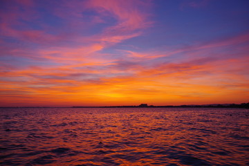 Naklejka na ściany i meble Colorful sunset on the ocean
