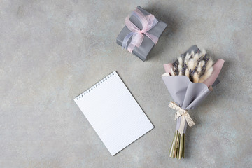 Bouquet of lavender and lagurus with gray-purple packaging with a gift box in a single color.