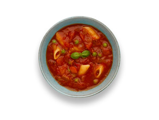 Isolated image of a bowl of delicious minestrone soup, topped with a sprig of basil, in a rustic bowl, with drop shadow.