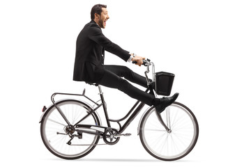 Crazy businessman riding a bicycle with legs up - Powered by Adobe