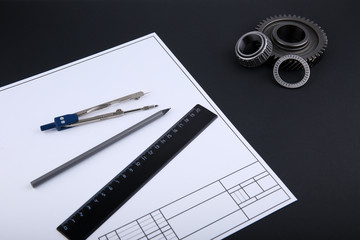 engineering background with drafting accessories and drafting paper