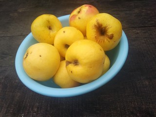 apples in a bowl on the table