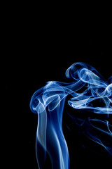 Abstract motion of white smoke isolated on a black background Can be modeled as hot food, smog, small clouds, and aromatic smoke.