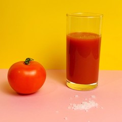 glass of tomato juice and fruits