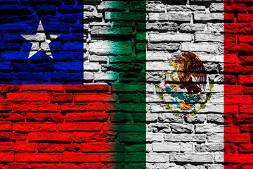 Flag of Chile and Mexico on brick wall