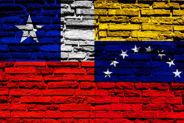 Flag of Chile and Venezuela on brick wall