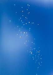 Many bright baloons in the blue sky.Color of the year 2020 background.