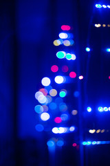 Festive colored lights.Blurred images and beautiful bokeh.Color of the year 2020 background.