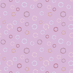 Seamless vector pattern with round elements of purple and blue on a light purple background.