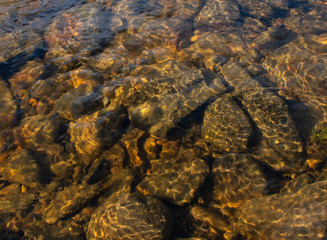 Underwater rocks with light patterns