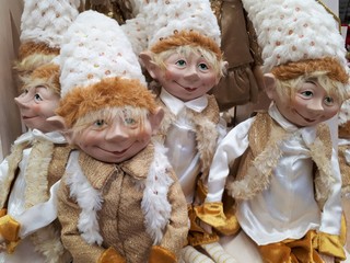close-up of decorative, vibrant, festive, toy gnomes / elves