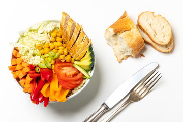 buddha bowl with chicken on wood