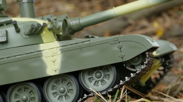 iron caterpillars of a battle tank in a combat position, camera in motion