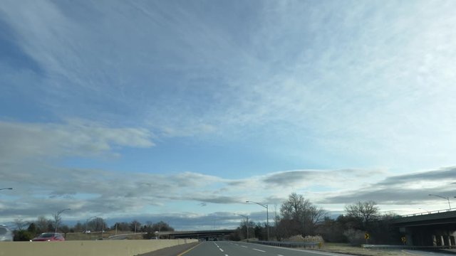 Car POV driving under I95 and Parkway sign