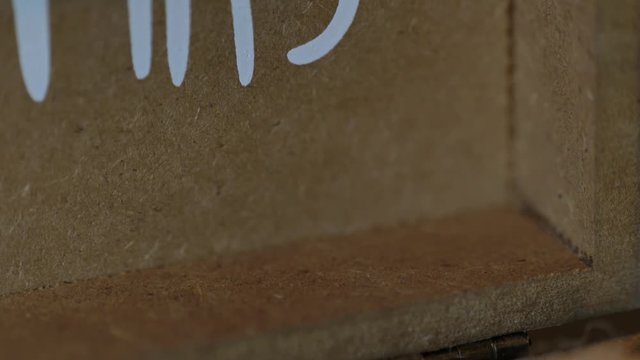 Slider reveal of wedding rings on brown burlap