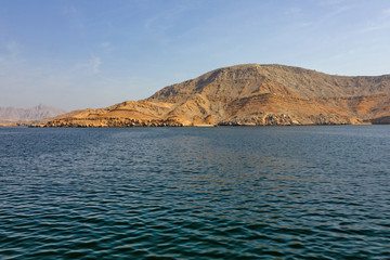Fototapeta na wymiar Mountain landscape, Oman fjords sea view, Khasab, Musandam peninsula.