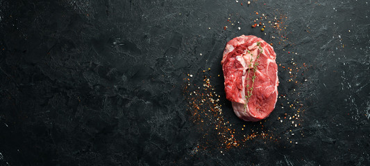 Raw marbled meat Steak Ribeye Black Angus. Top view. free space for your text. Rustic style.