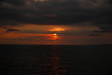 Naklejka na ściany i meble Sunset at sea in the Manuel Antonio National Park. Costa Rica