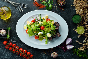 Salad of vegetables, blood sausage and mushrooms on a plate. Top view. free space for your text. Rustic style.