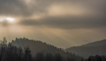 Obraz premium White snowy meadow with Doupovske mountains in mist