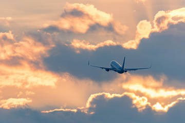 Naklejka na ściany i meble View of airplane going up against beautiful sky