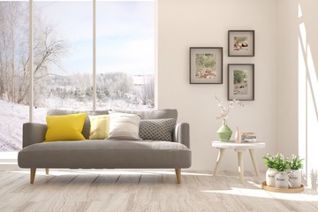 Stylish room in white color with sofa and winter landscape in window. Scandinavian interior design. 3D illustration