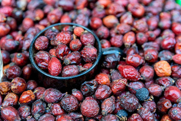 Close up pile of dried fruit of rosehip or wild rose