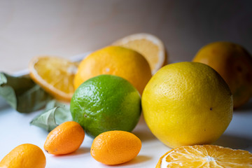 Naklejka na ściany i meble Classic shot of citrus fruits in the kitchen on white background