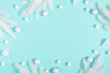 Fototapeta na wymiar Christmas holiday composition. White decoration on pastel blue background. Christmas, New Year, winter concept. Flat lay, top view, copy space