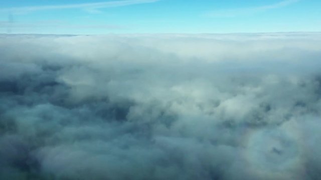 Camera is slowly moving through the very cloud blue sky