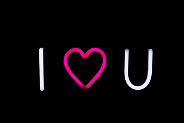 White and pink i love you neon sign on isolated black background. Neon concept. Modern style. Neon sign.