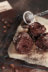 The process of making zephyr marshmallow at pastry shop kitchen. Homemade coffee marshmallow. Food photography. Zephyr dusted with brown powdered cocoa.