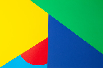 Abstract geometric shape yelllow, blue, red, green color paper background