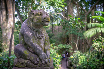 Fototapeta na wymiar Statue of a calf, Monkey forest, Ubud, Bali, Indonesia