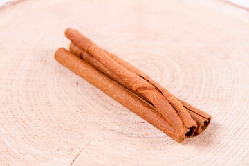 Cinnamon sticks on a wooden background	