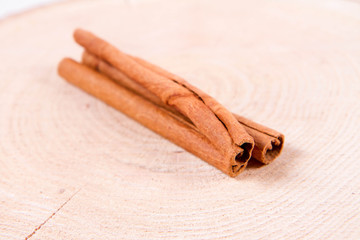 Cinnamon sticks on a wooden background	