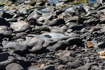 Volcanic rocks structure smooth lava stone background texture.