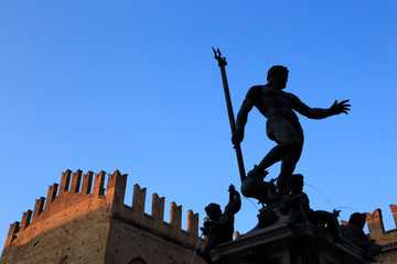 Fountain of Neptune (Fontana di Nettuno) in Bologna, Italy. Silhouette against clear blue sky at sunset. © Predrag Jankovic