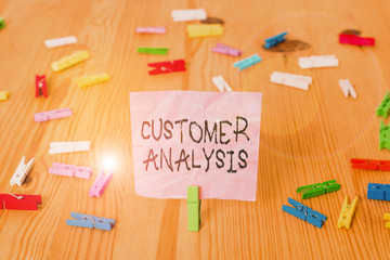 Conceptual hand writing showing Customer Analysis. Concept meaning systematic examination of a company s is customer information Colored crumpled papers wooden floor background clothespin