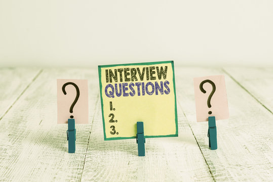 Handwriting text writing Interview Questions. Conceptual photo Typical topic being ask or inquire during an interview Scribbled and crumbling sheet with paper clips placed on the wooden table