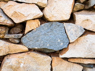 Stone wall texture background natural color close up.