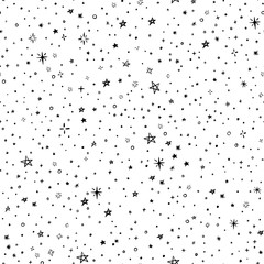 Minimalistic vector background. Creative doodle. Abstract stars and dots. Black graphic seamless pattern isolated on white. Universal print for the design of textiles, paper, cards, wallpapers, etc.