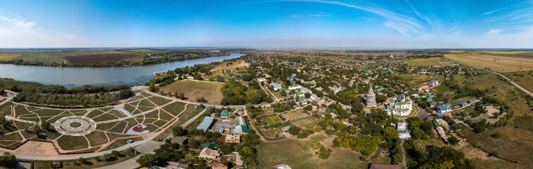 Fototapeta na wymiar a large aerial panorama of the city of Starocherkassk on a sunny summer day from the discharge side - the old capital of the Don Cossacks in the steppe near the Don River
