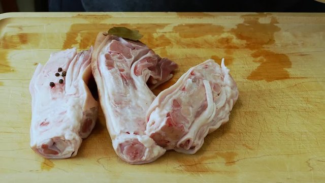 Pigs feet, onions, garlic and bay leves