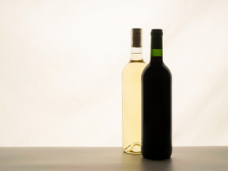 Close up of two bottles of wine unlabelled