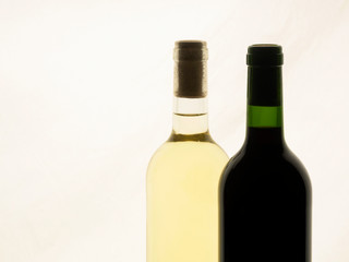 Close up of two bottles of wine unlabelled