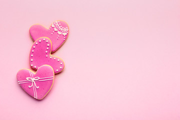 Heart shaped cookies for Valentine's day on color background